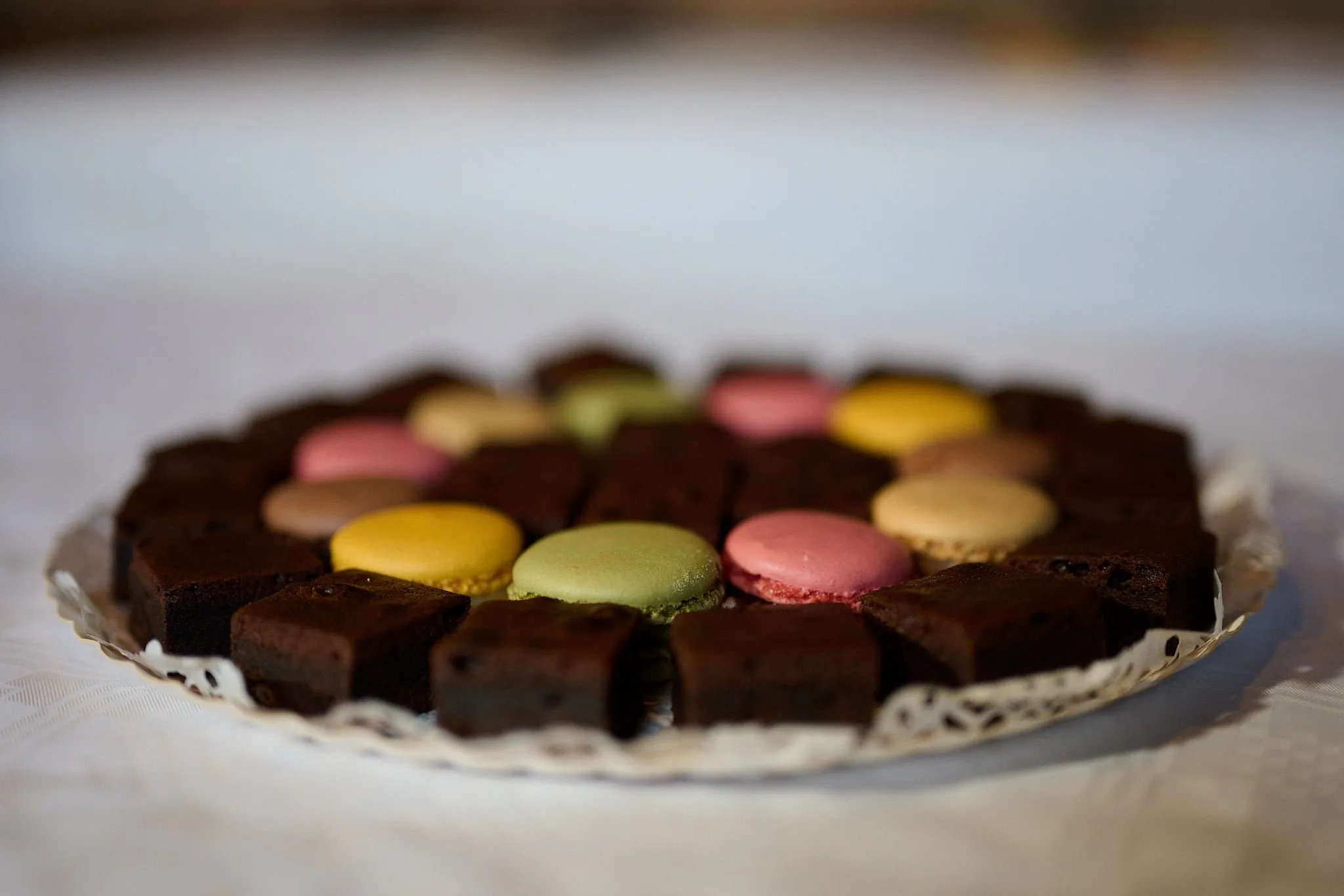 Dish of brownies and colourful macarons