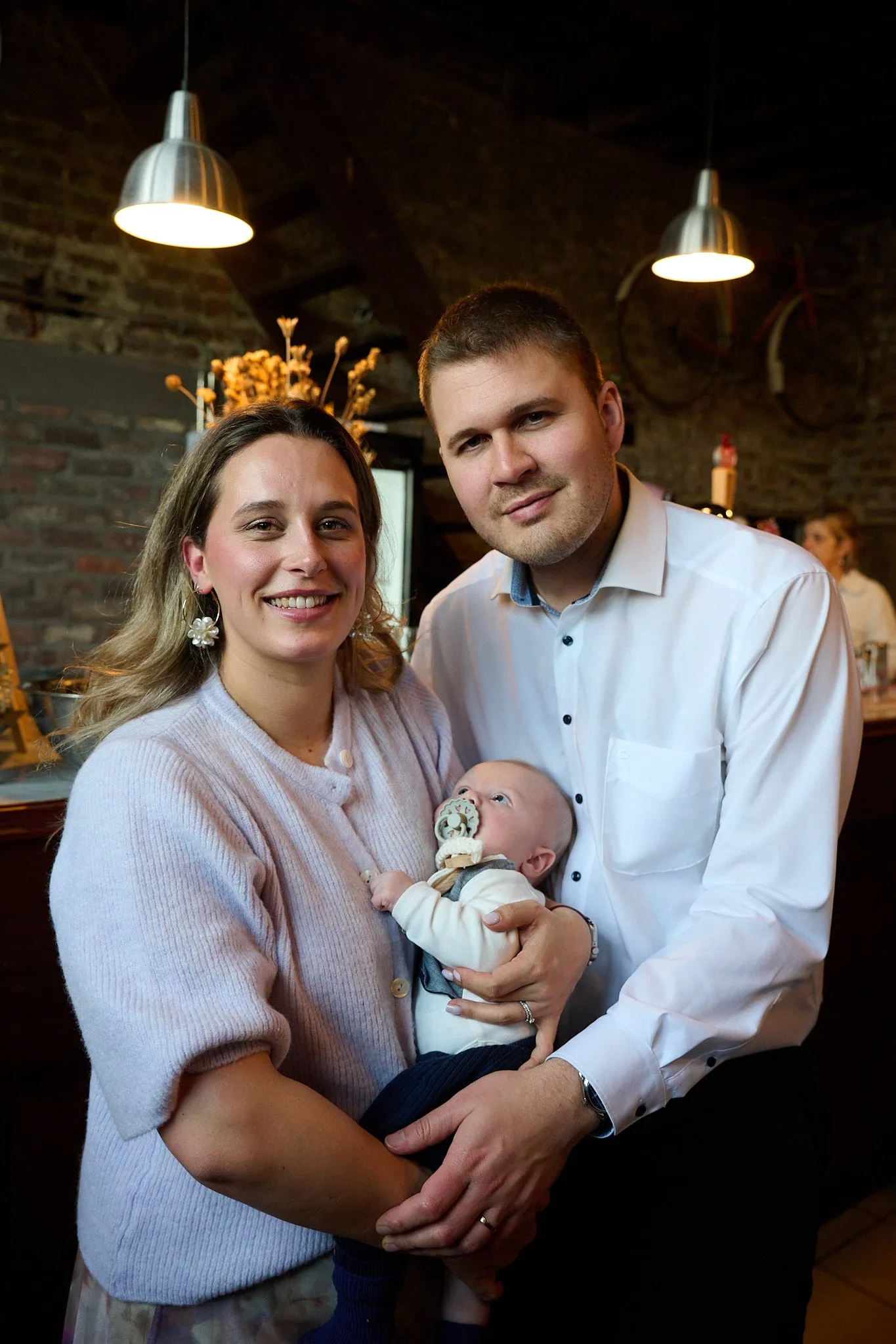 Family portrait of young parents with their baby in colour