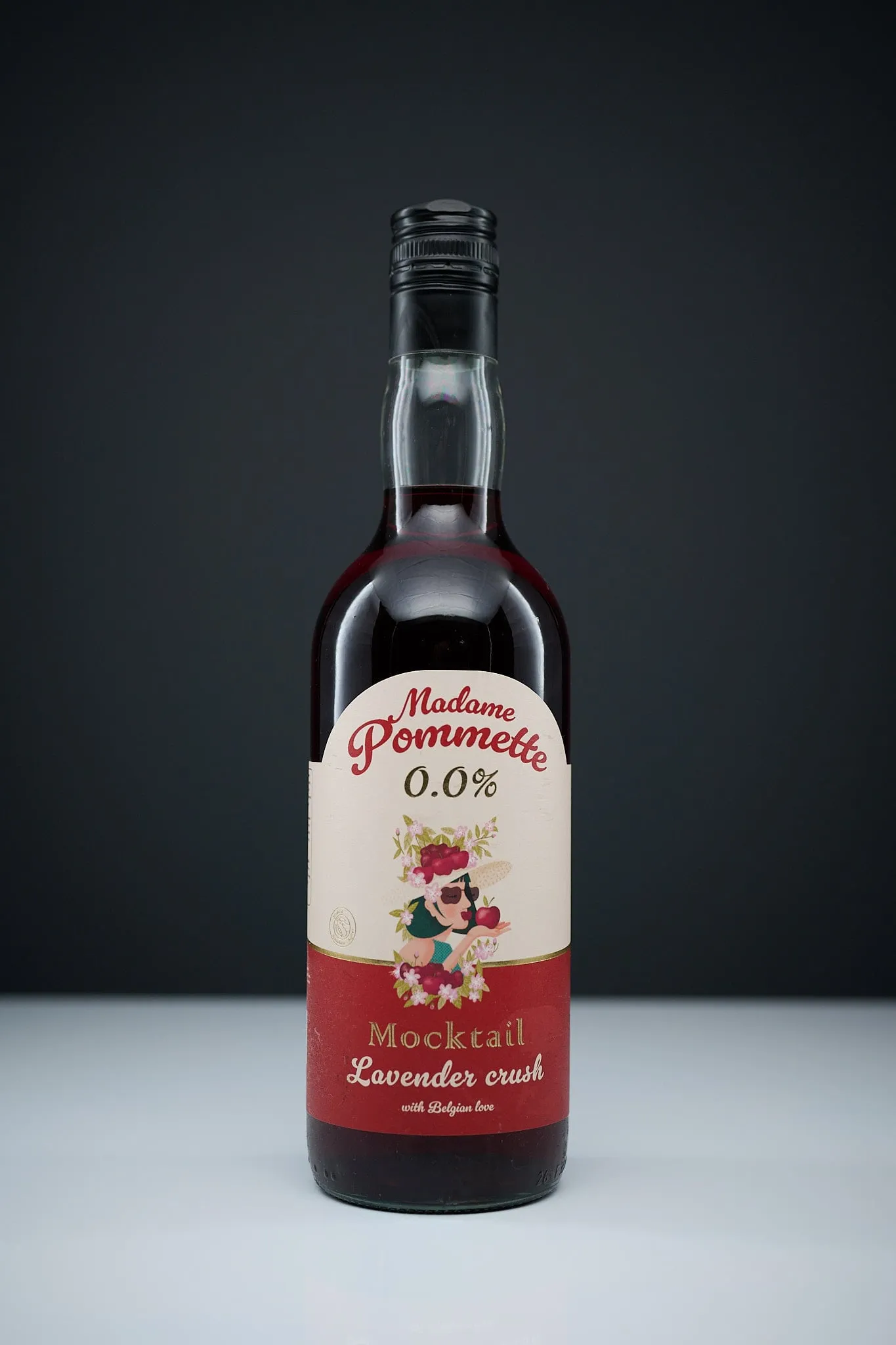 Bottle of Madame Pommette Lavender Crush mocktail against a dark background